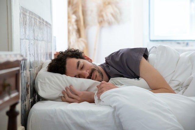 man sleeping happily